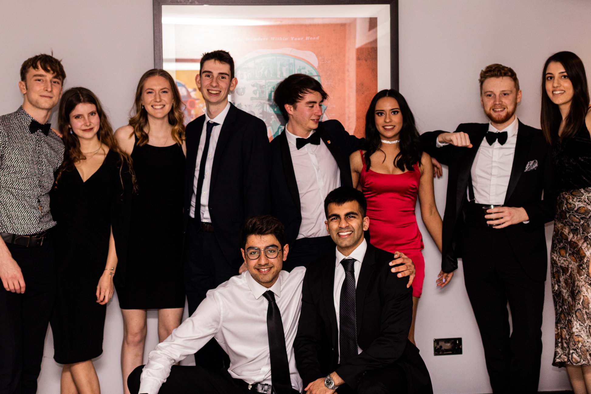 An image taken at the css ball, showing a group of friends posing for a photo